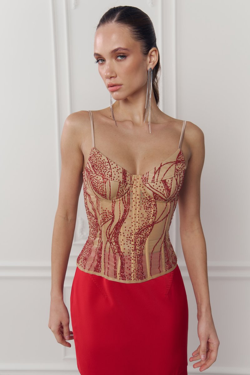 Червоний сатиновий корсет з мерехтливими блискітками
Червоний сатиновий корсет з мерехтливими блискітками