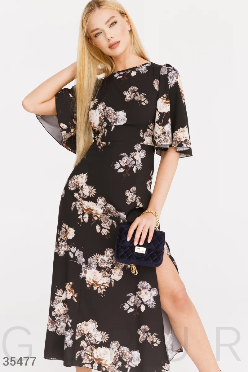 Flowing black dress with flowers photo 1