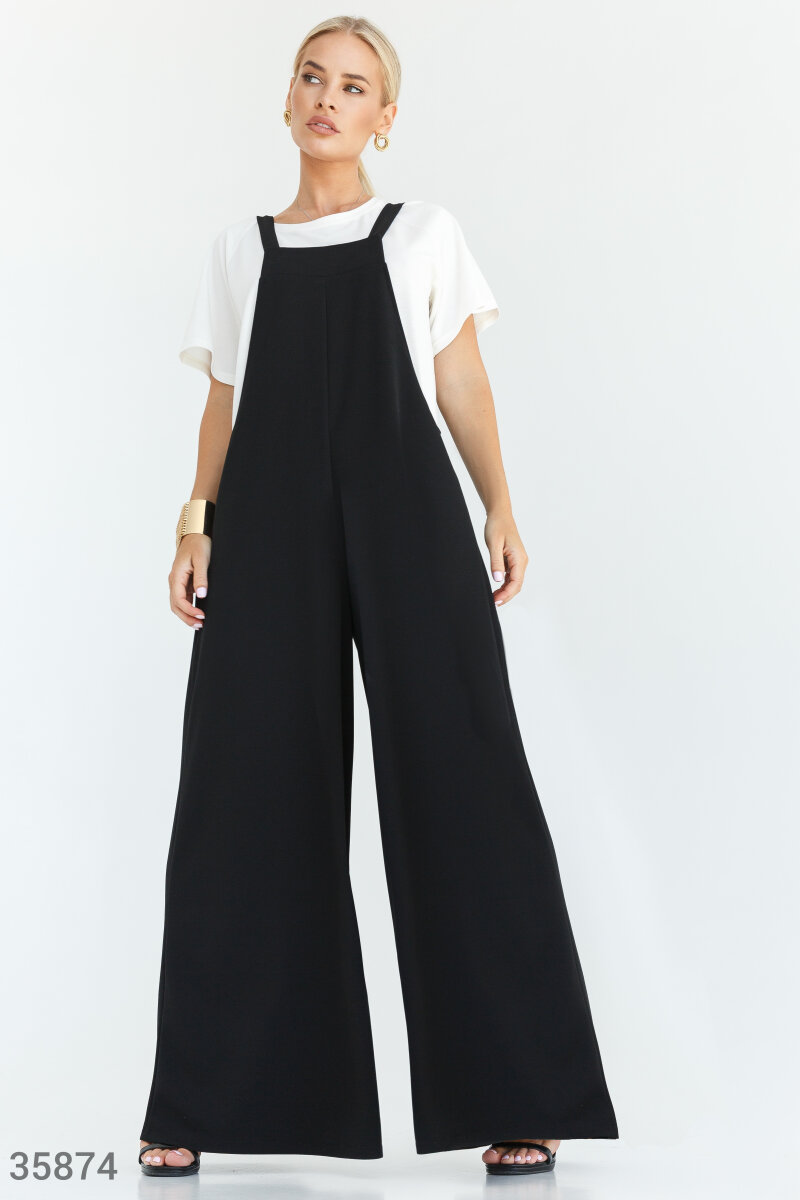 Oversized black jumpsuit with square shaped neckline