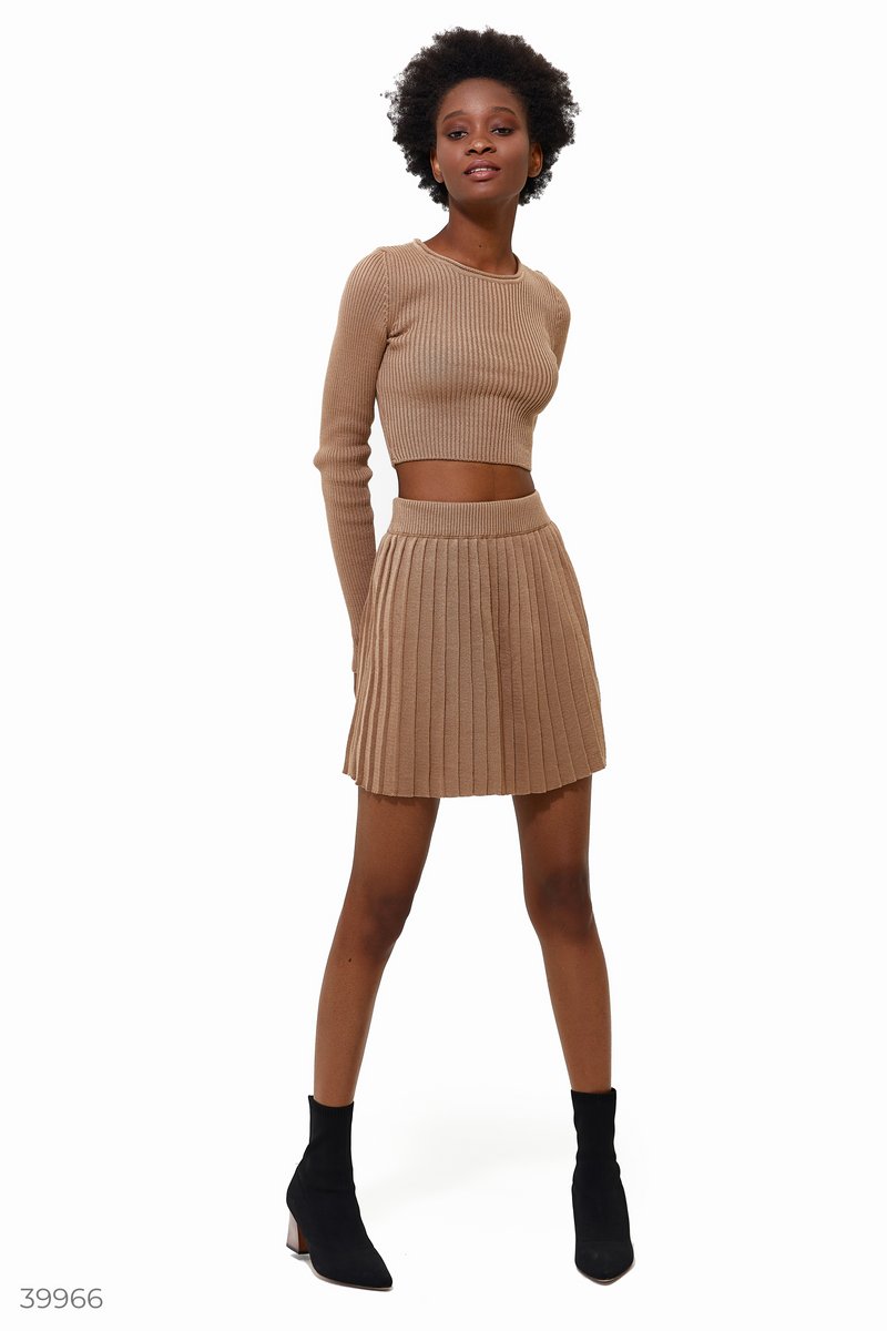 Beige knitted suit with a short skirt
