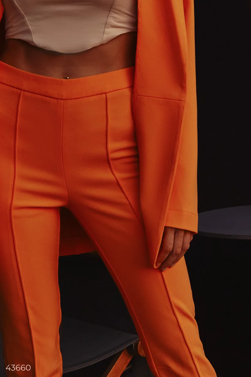 Оранжевые брюки с разрезами фотография 5