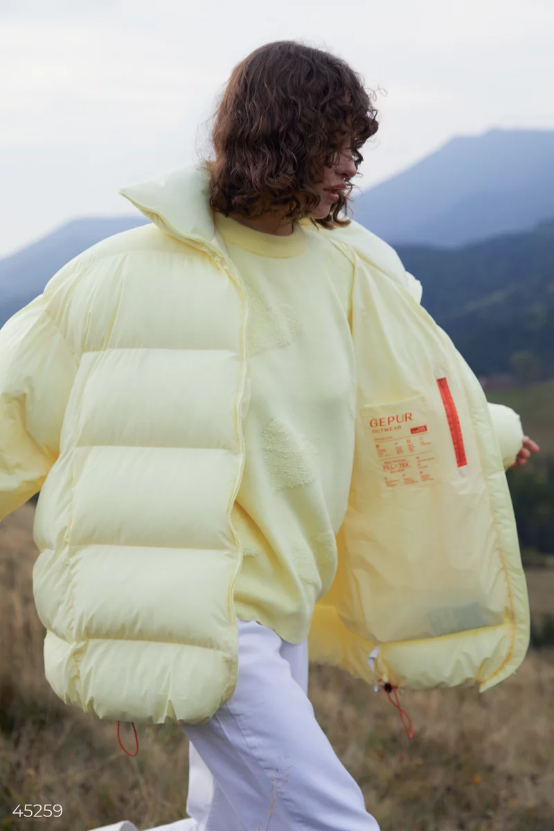Warm three-dimensional down jacket in a lemon shade photo 5