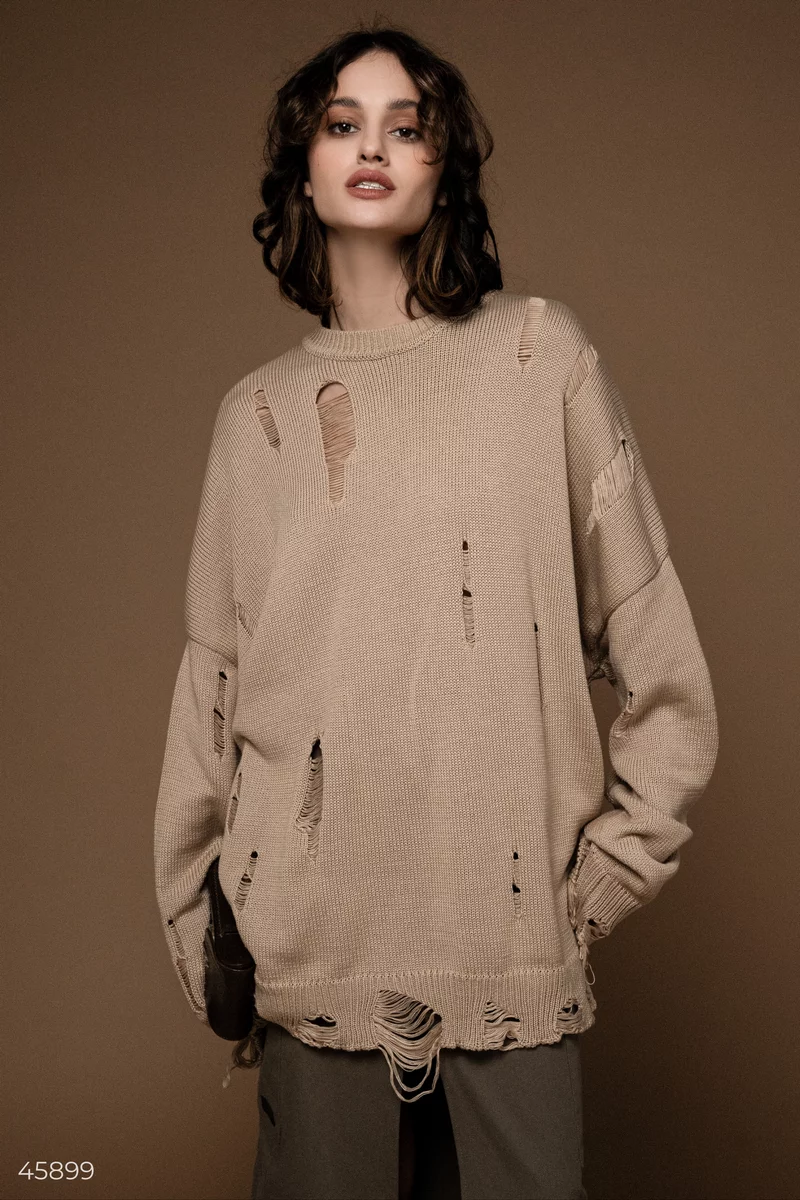 Long beige sweater with a torn edge photo 1