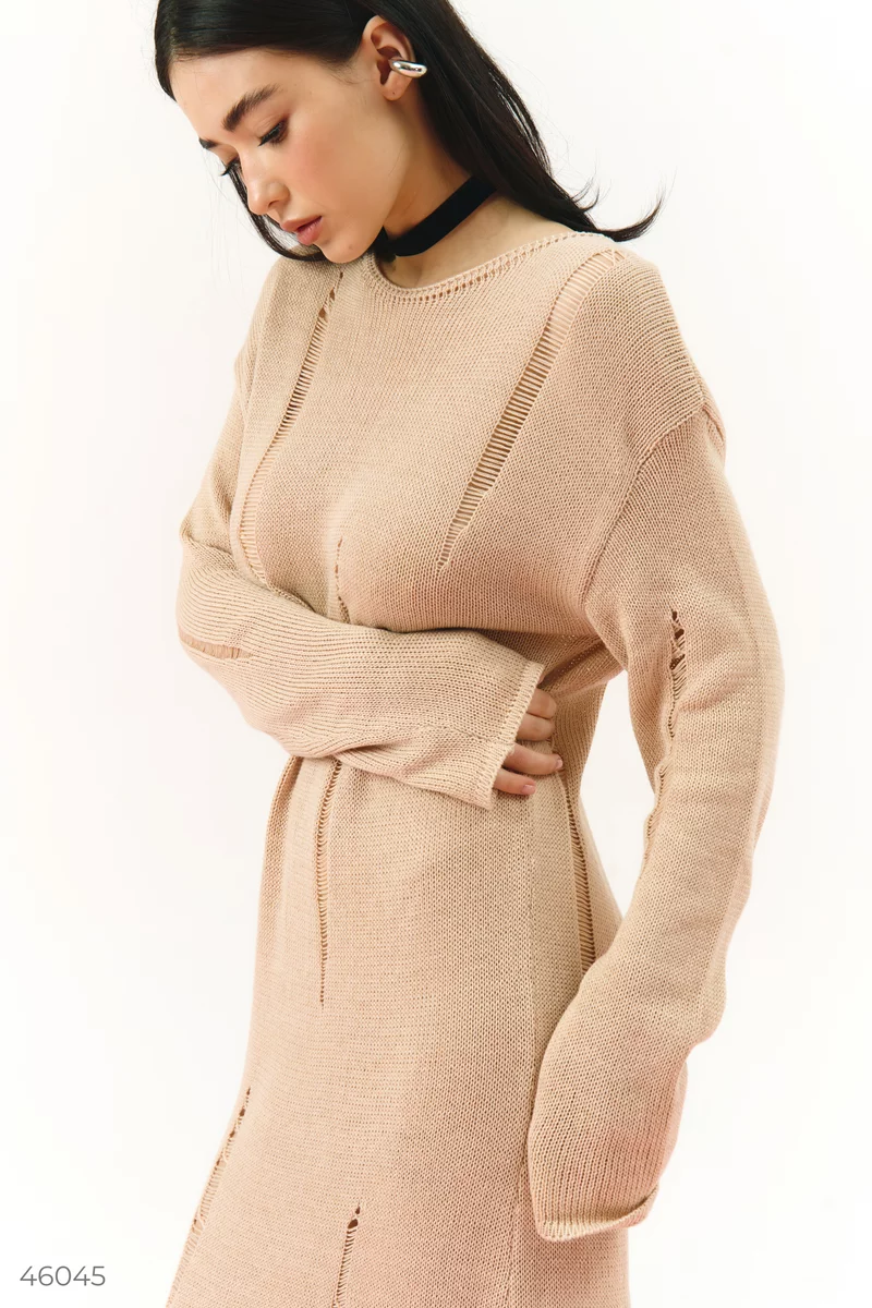Beige knitted dress with torn details photo 1