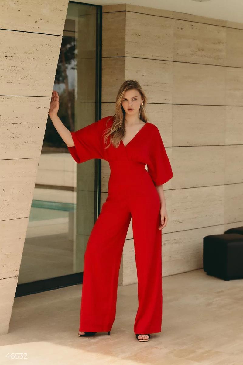Red jumpsuit with draping at the waist photo 1