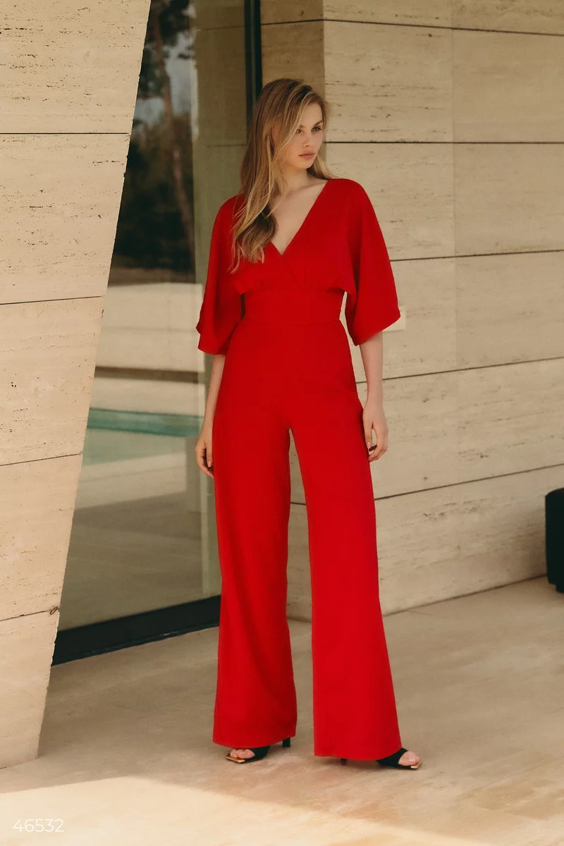 Red jumpsuit with draping at the waist photo 2