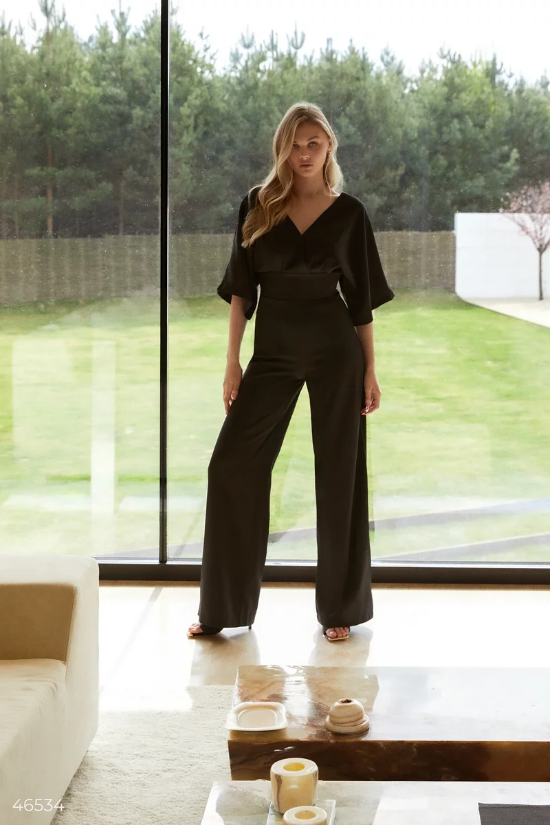 Black jumpsuit with draping at the waist photo 1