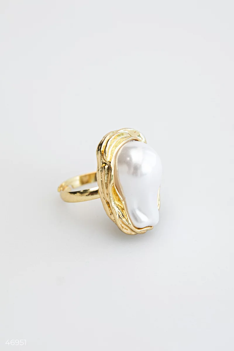 A golden ring with a mother-of-pearl insert photo 2