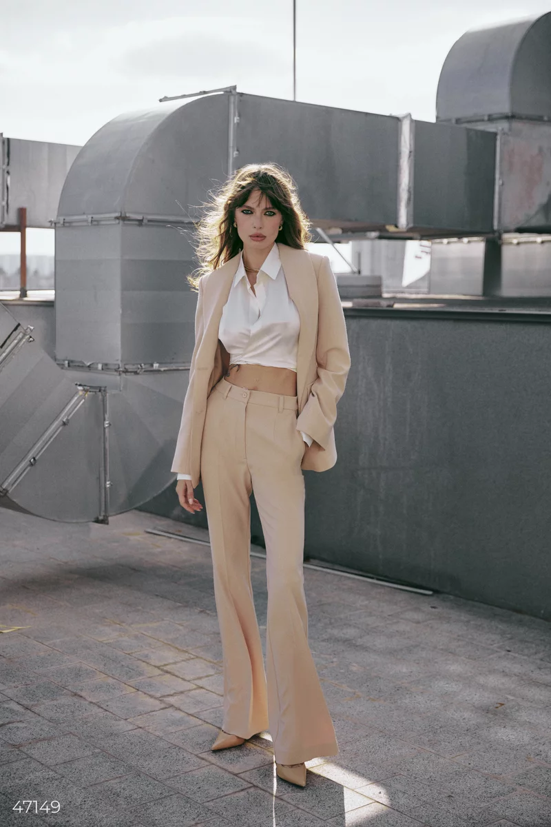 High-waisted beige flared pants photo 1