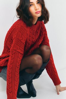 Oversized red sweater with braids