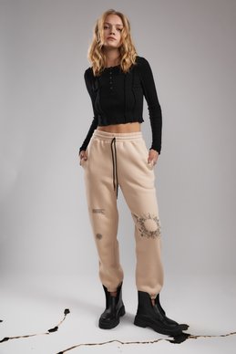 Beige joggers on fleece with a print