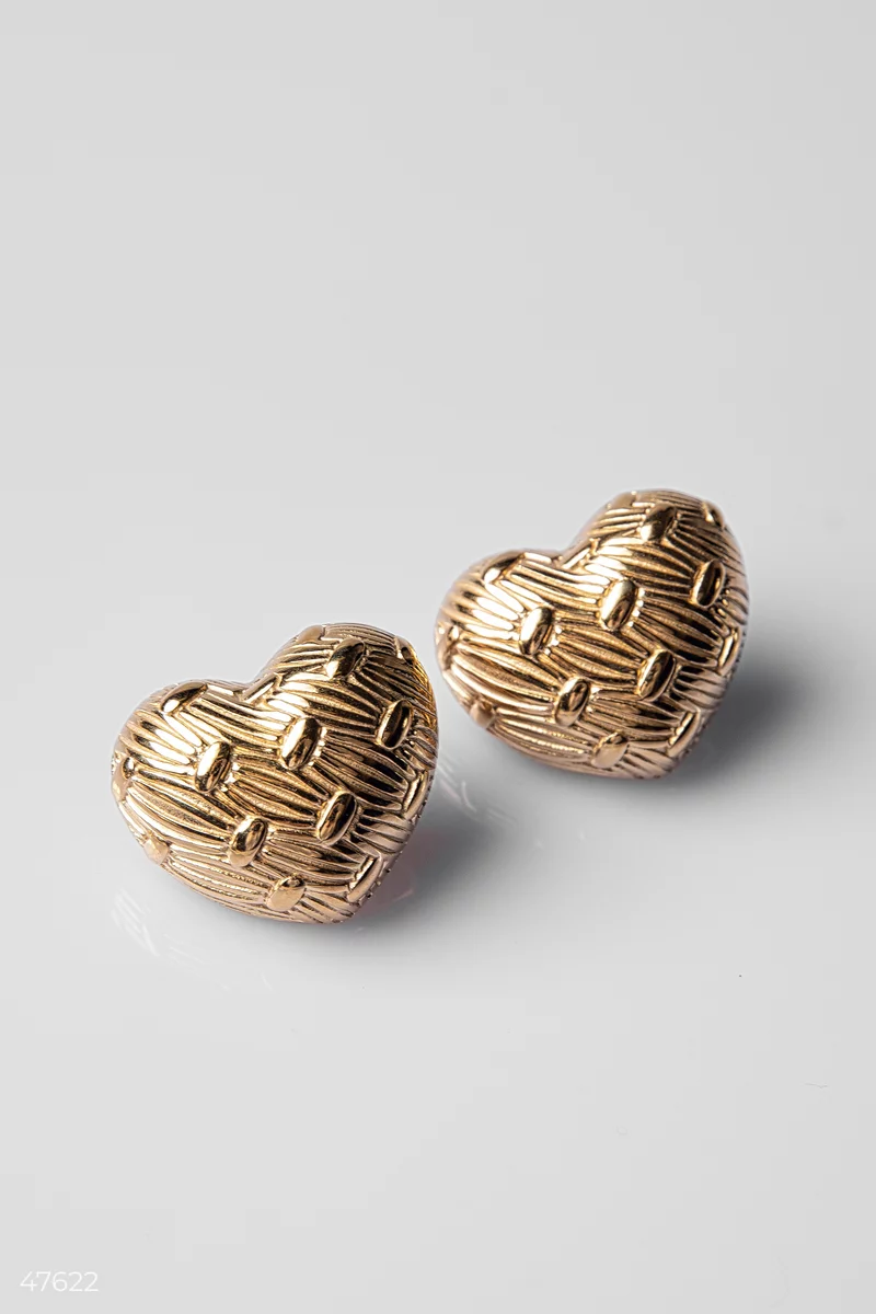 Golden earrings in the shape of a heart photo 1