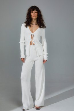 Milk suit with pants and a top with ties