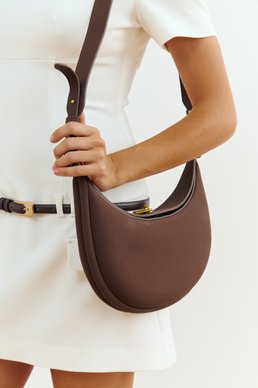 Brown crescent-shaped convertible bag
