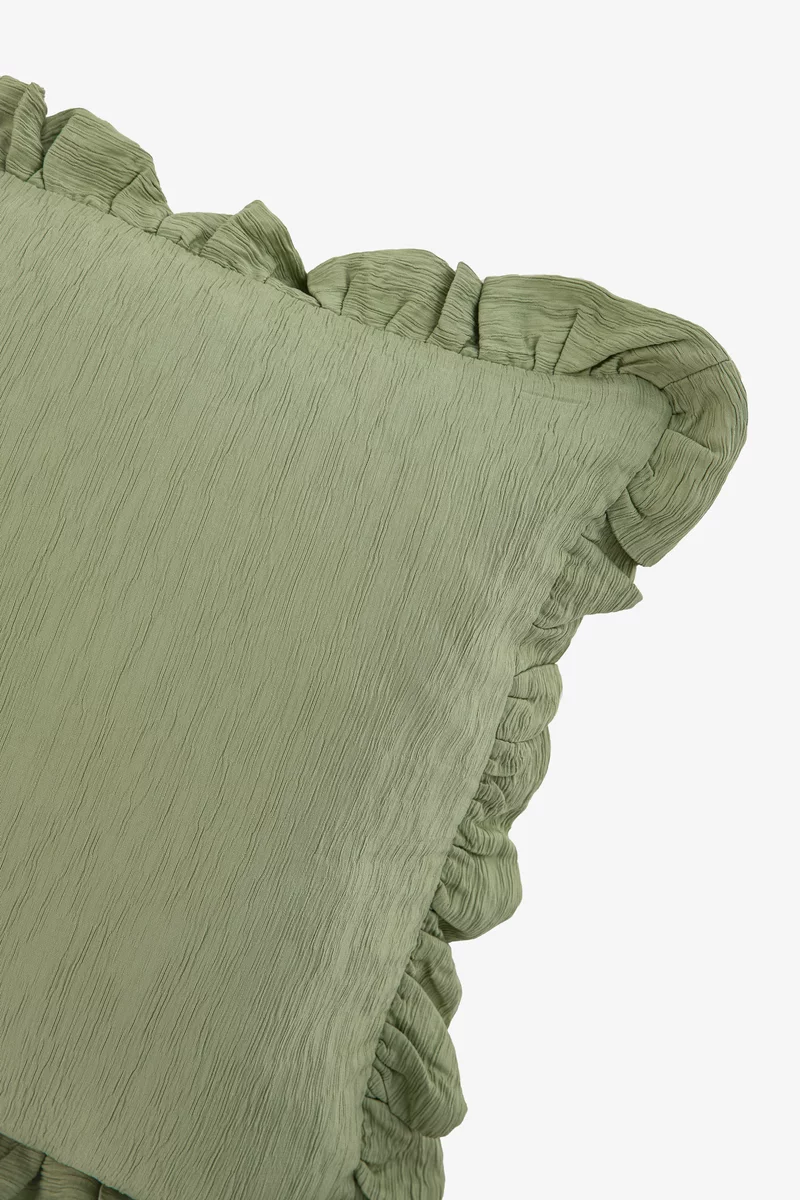 Зеленая подушка с наволочкой из жатки фотография 5