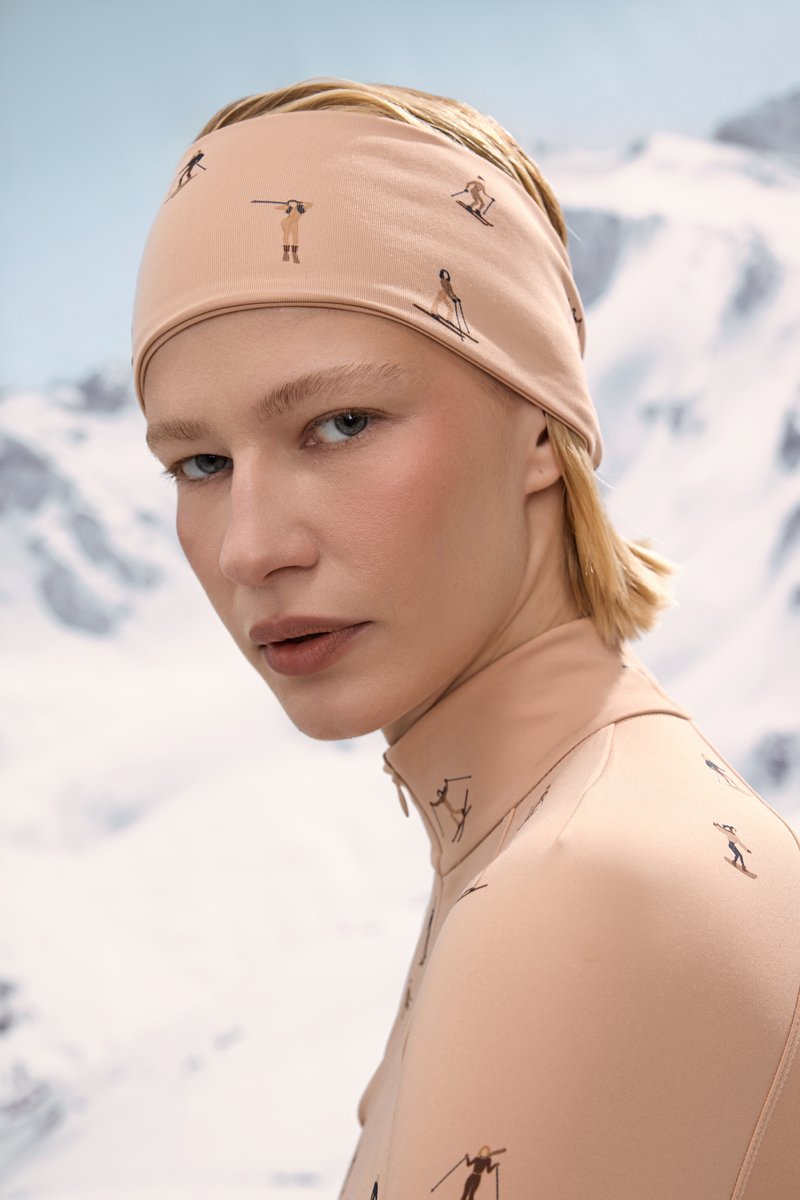 

Бежева трикотажна пов'язка з гірськолижним принтом