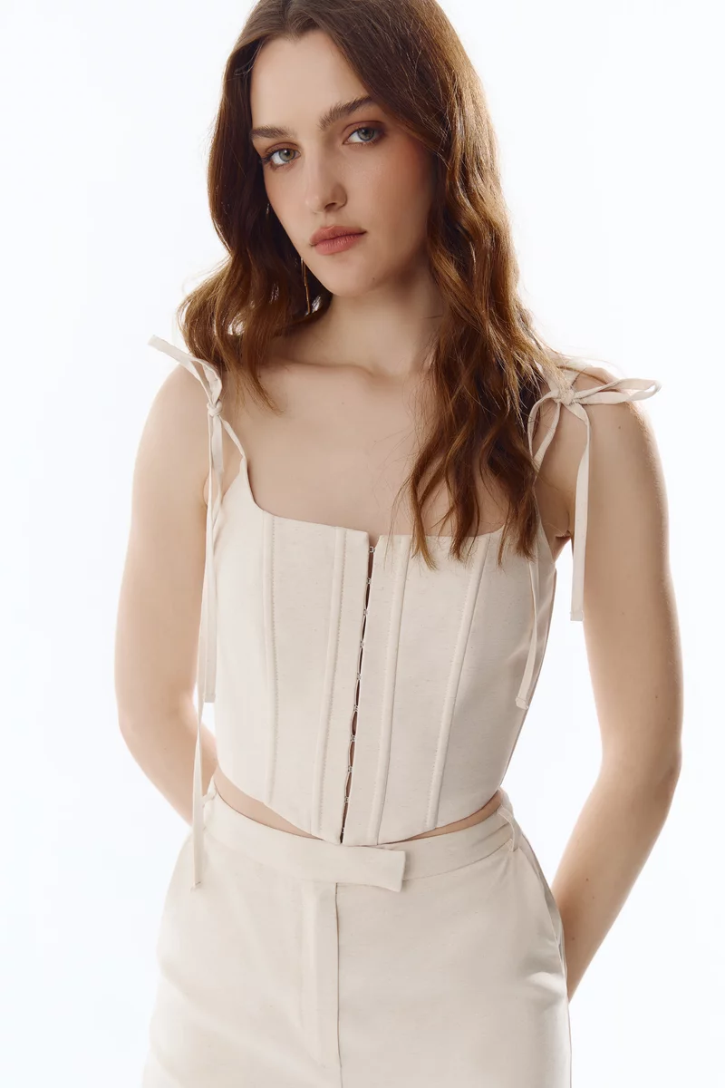 Молочний корсет на тонких бретелях фотографія 2