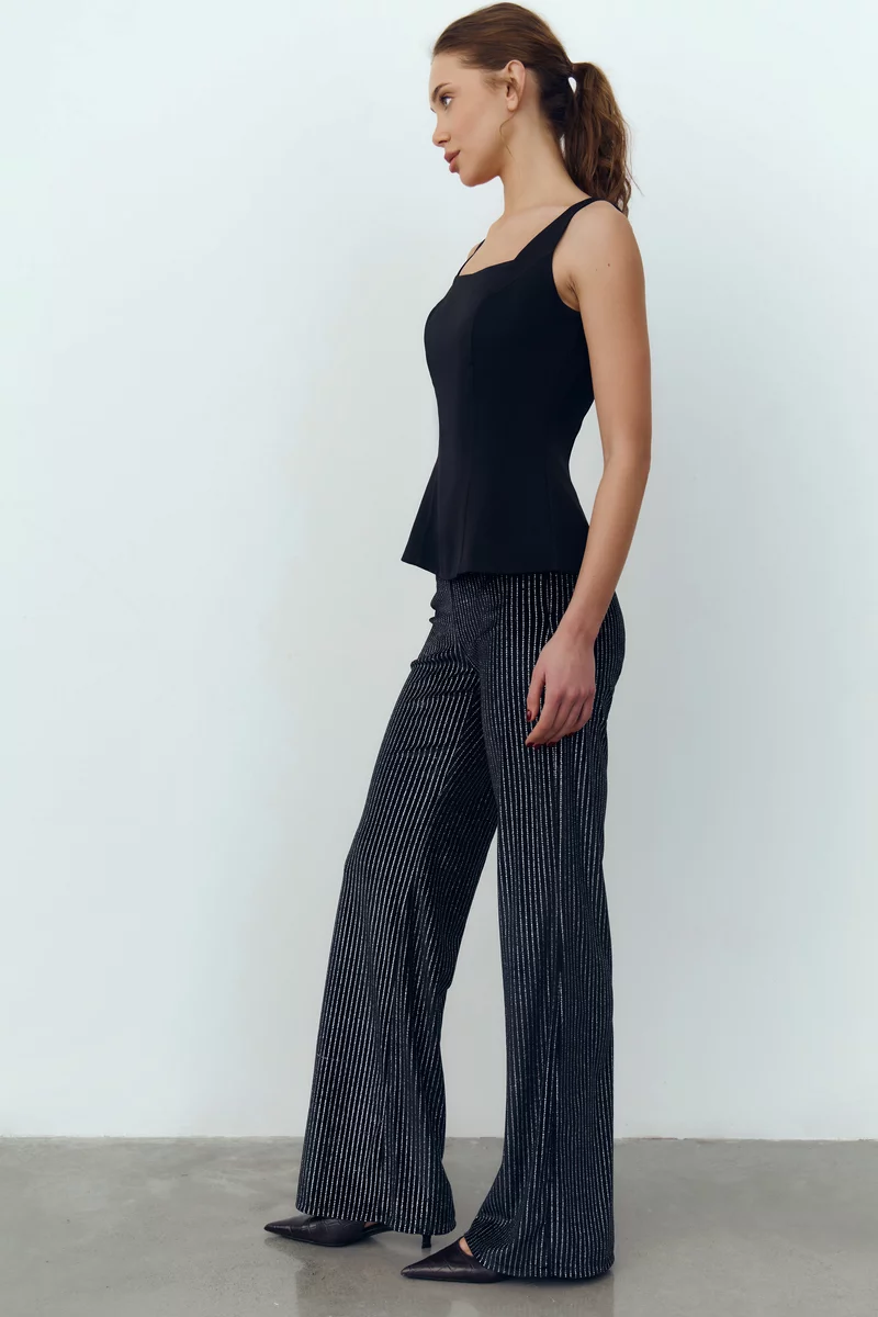 Черные бархатные брюки с серебристым напылением фотография 2