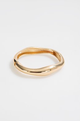 Золотистый браслет закругленной формы