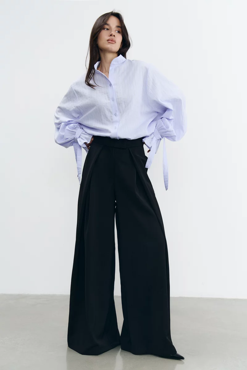 Чорні штани-палаццо з защіпами вільного крою фотографія 1