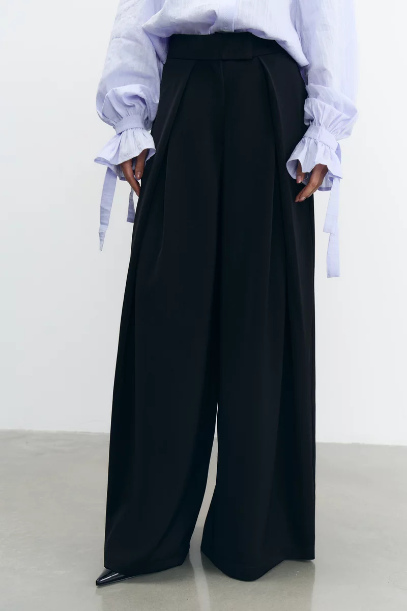 Чорні штани-палаццо з защіпами вільного крою фотографія 3