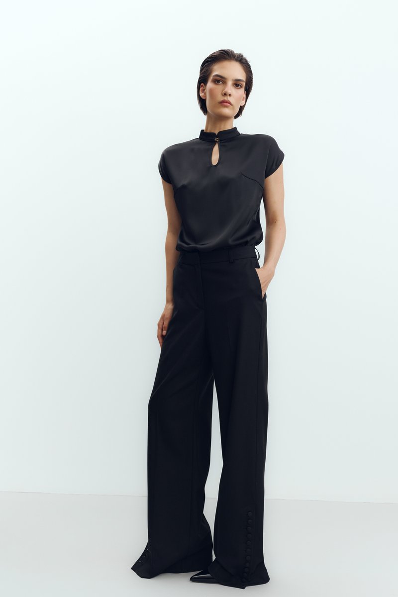 Black pants with accent buttons image 1