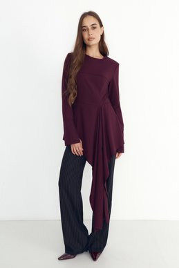 Burgundy top with an asymmetrical cut